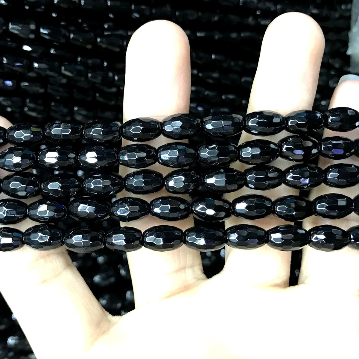 CAG760 Black Agate Beads Faceted Rice 6x9mm 15" Strand