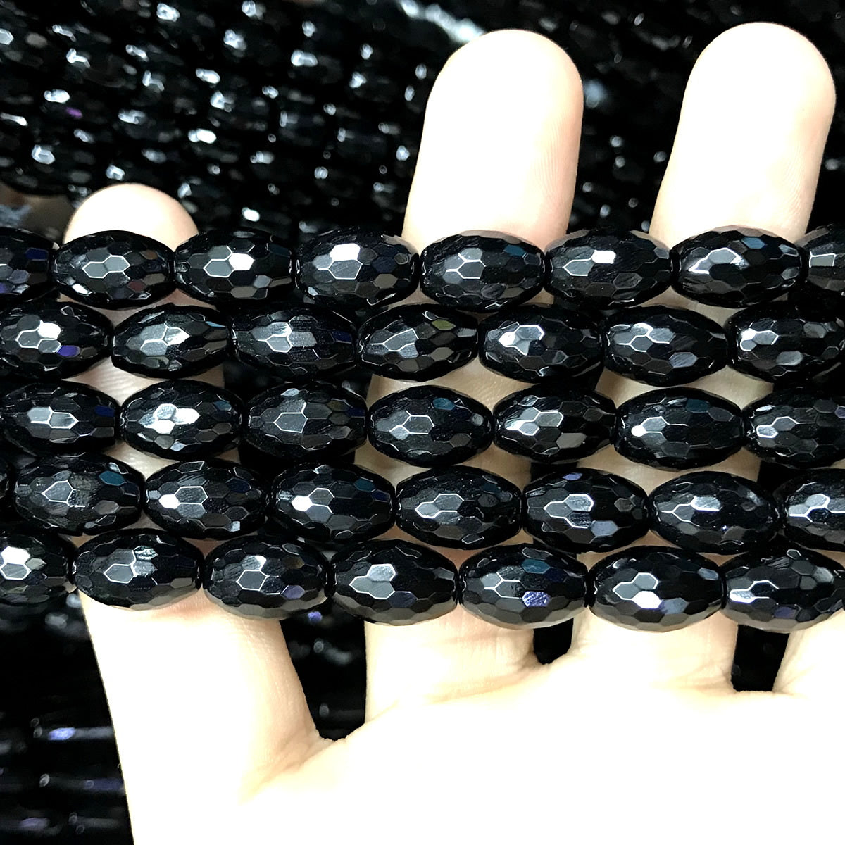 CAG761 Black Agate Beads Faceted Rice 8x12mm 15" Strand