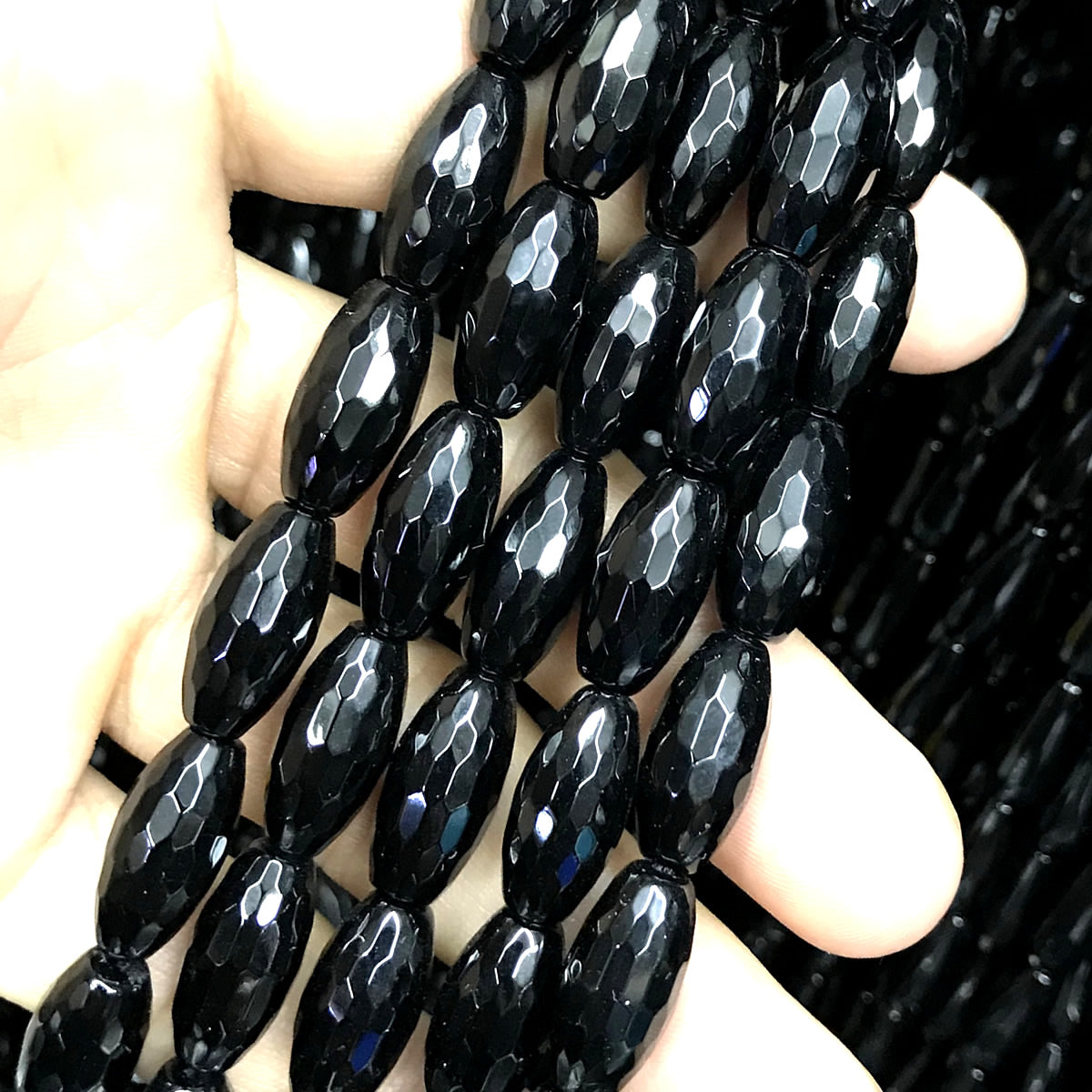 CAG762 Black Agate Beads Faceted Rice 6x16mm 15" Strand