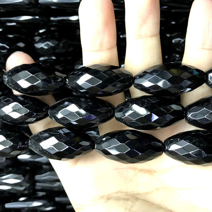 CAG769 Black Agate Beads Faceted Rice 15x30mm 15" Strand