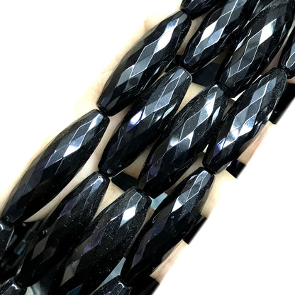 CAG770 Black Agate Beads Faceted Rice 12x50mm 15" Strand