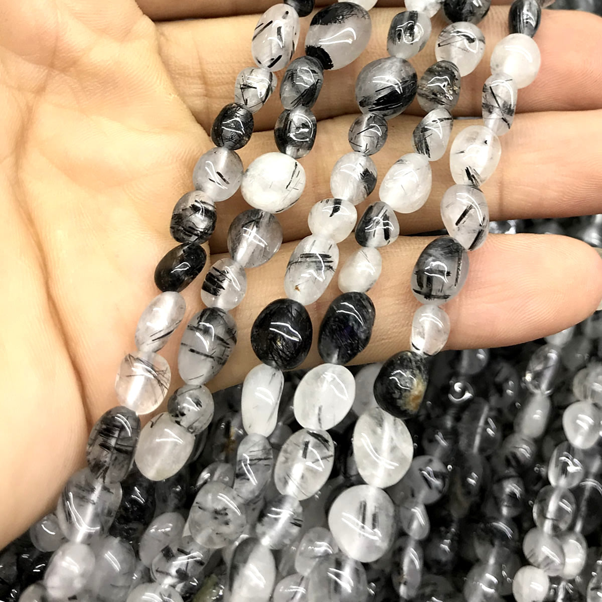 CNG08 Black Rutilated Quartz Beads Smooth Nugget 6x8mm 15" Strand