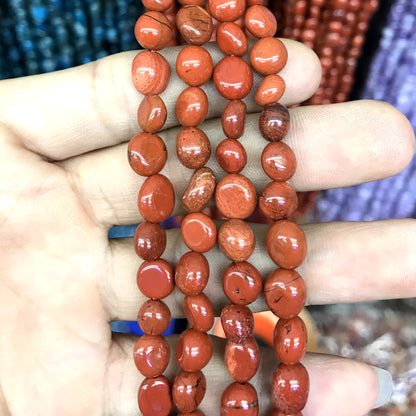 CNG24 Red Jasper Beads Smooth Nugget 6x8mm 15" Strand