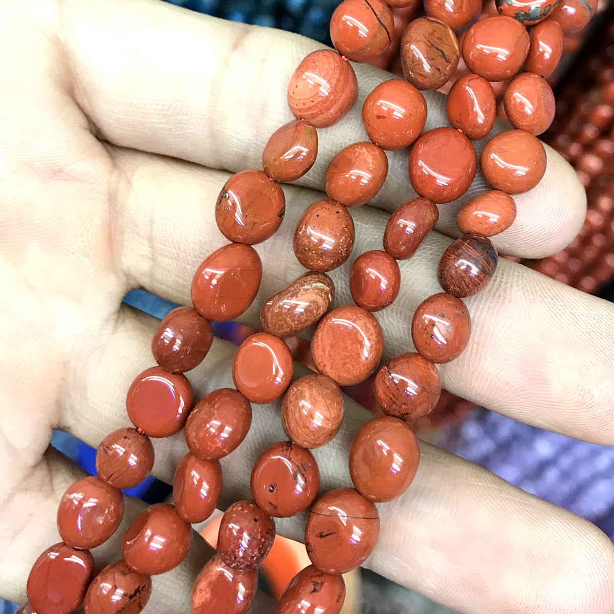 CNG24 Red Jasper Beads Smooth Nugget 6x8mm 15" Strand