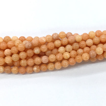 CCA11 Peach Calcite Beads Smooth Round 6mm 15.5" Strand