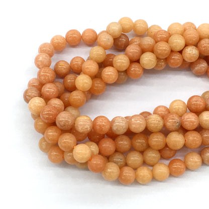 CCA14 Peach Calcite Beads Smooth Round 10mm 15.5" Strand