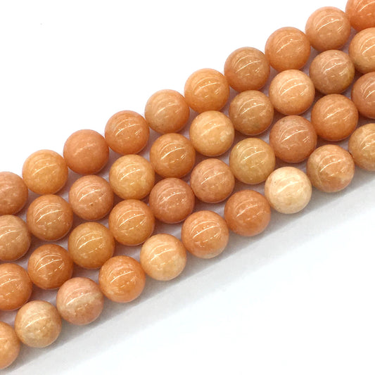 CCA16 Peach Calcite Beads Smooth Round 14mm 15.5" Strand