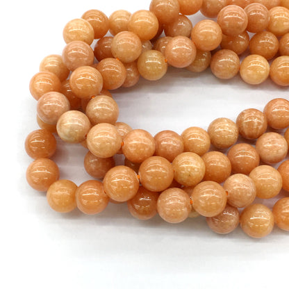 CCA16 Peach Calcite Beads Smooth Round 14mm 15.5" Strand